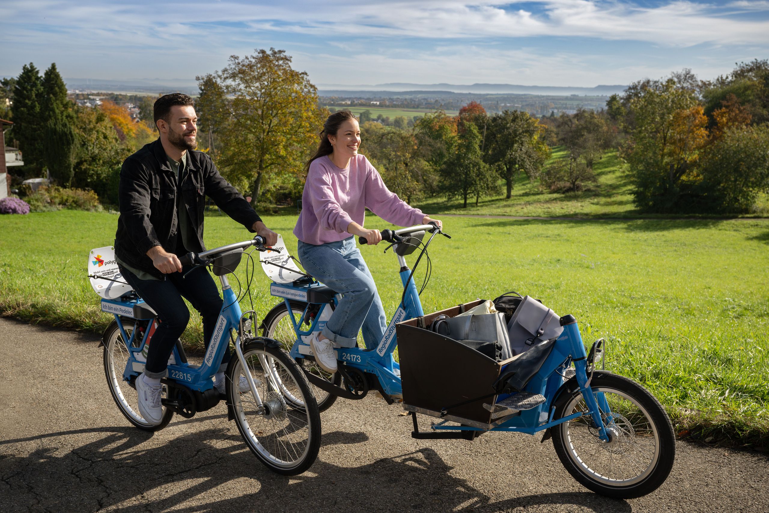 Two friends riding a RegioRad Pedelec and a cargo pedelec